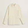 Women's cream-colored cotton shirt with floral embroidery
