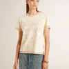 Women's cream T-shirt with faded red accents