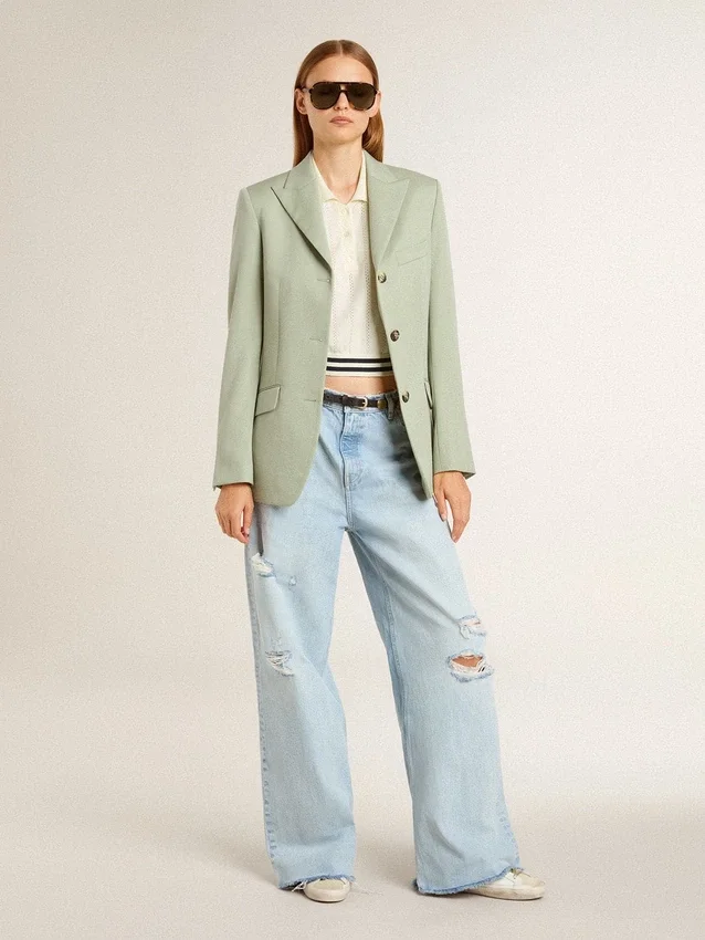Women's cropped worn-white cotton polo shirt with blue ribbing