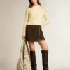 Women's cropped worn-white sweater with decorative crystals