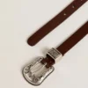 Women's dark brown leather belt with decorated silver buckle