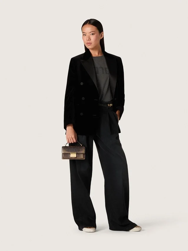 Women's pants in black cotton denim with a lived-in treatment