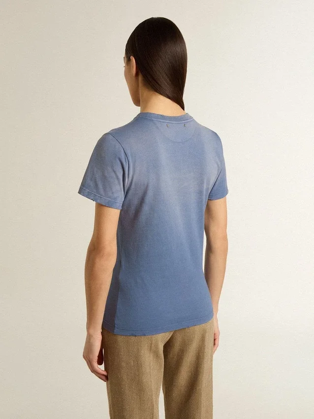 Women's faded light blue T-shirt with print on the chest