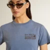 Women's faded light blue T-shirt with print on the chest