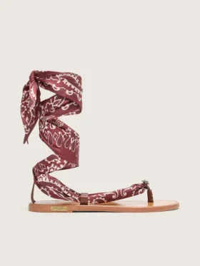 Women’s flat sandals with burgundy paisley pattern and jewel detail