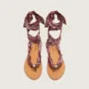 Women’s flat sandals with burgundy paisley pattern and jewel detail
