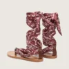 Women’s flat sandals with burgundy paisley pattern and jewel detail