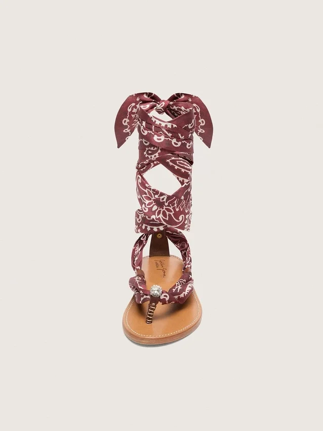 Women’s flat sandals with burgundy paisley pattern and jewel detail