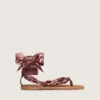 Women’s flat sandals with burgundy paisley pattern and jewel detail