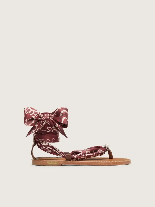 Women’s flat sandals with burgundy paisley pattern and jewel detail