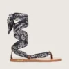 Women’s flat sandals with dark blue paisley pattern and jewel detail