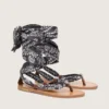 Women’s flat sandals with dark blue paisley pattern and jewel detail