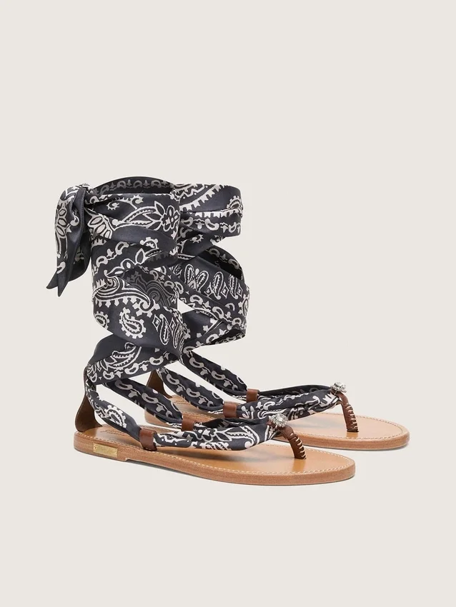 Women’s flat sandals with dark blue paisley pattern and jewel detail