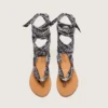 Women’s flat sandals with dark blue paisley pattern and jewel detail