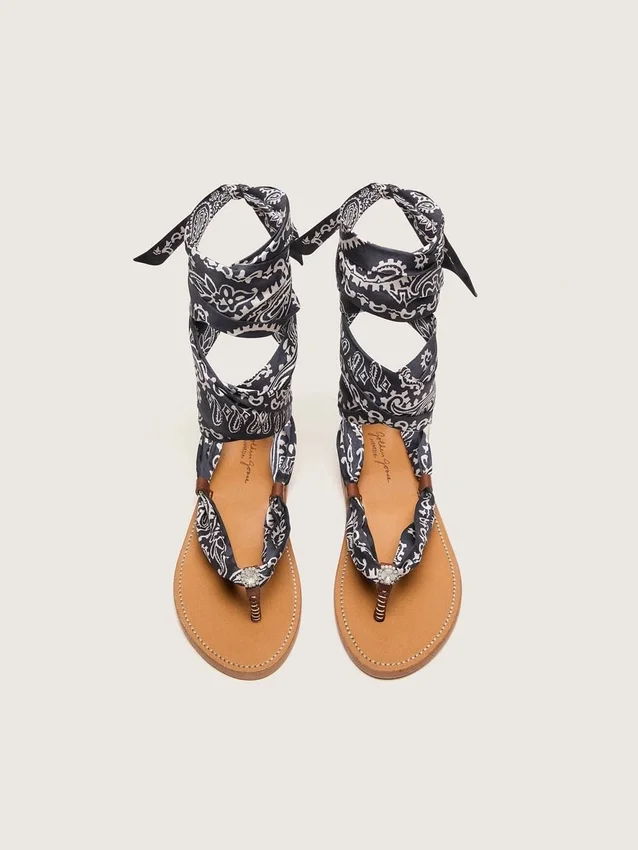 Women’s flat sandals with dark blue paisley pattern and jewel detail