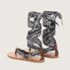 Women’s flat sandals with dark blue paisley pattern and jewel detail