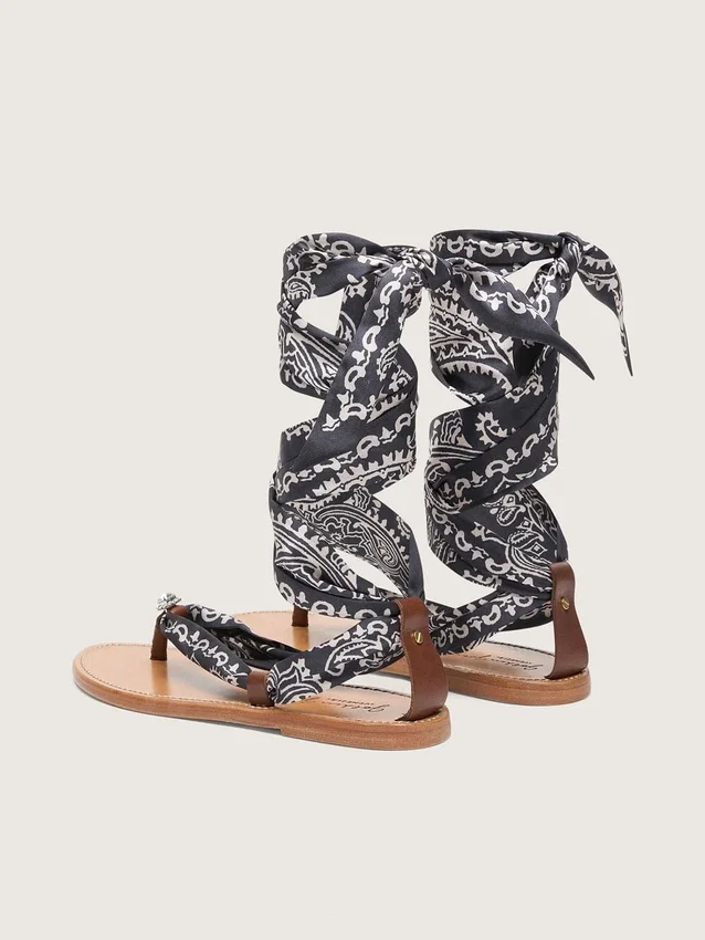 Women’s flat sandals with dark blue paisley pattern and jewel detail