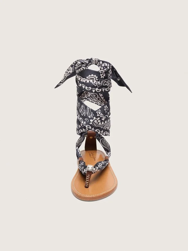 Women’s flat sandals with dark blue paisley pattern and jewel detail