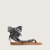 Women’s flat sandals with dark blue paisley pattern and jewel detail