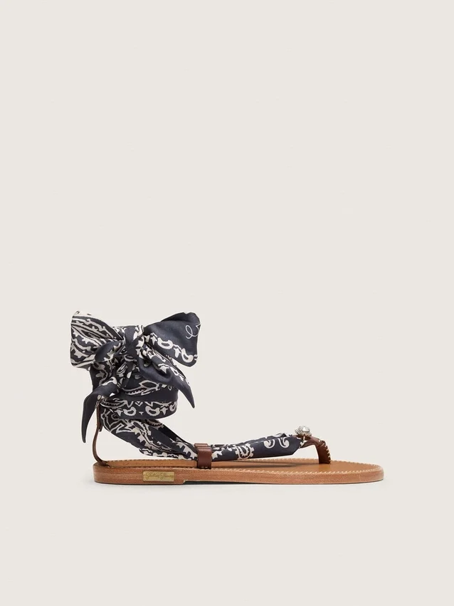Women’s flat sandals with dark blue paisley pattern and jewel detail