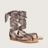 Women’s flat sandals with gray paisley pattern and jewel detail
