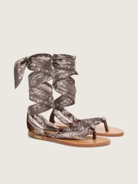 Women’s flat sandals with gray paisley pattern and jewel detail