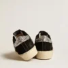 Women’s Hi Star in black leather with silver glitter heel tab