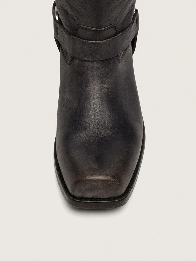 Women's high Biker boots in black leather with strap and silver-colored buckle