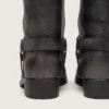 Women's high Biker boots in black leather with strap and silver-colored buckle