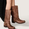 Women's high Biker boots in brown leather with strap and antique gold-colored buckle