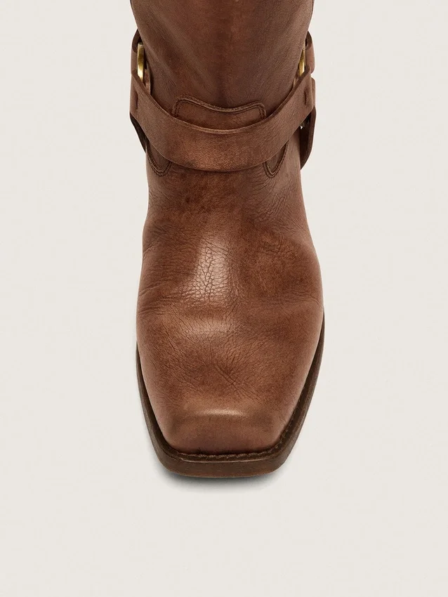 Women's high Biker boots in brown leather with strap and antique gold-colored buckle