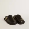 Women's Lucy Sabot in glossy black leather with gold metal buckle