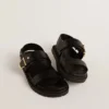 Women's Lucy sandal in glossy black leather with gold metal buckle