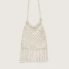 Women's macramé bag in butter-colored cotton with a leather lobster charm