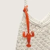 Women's macramé bag in butter-colored cotton with a leather lobster charm