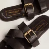 Women's Margaret flat sandals in black resin-coated leather