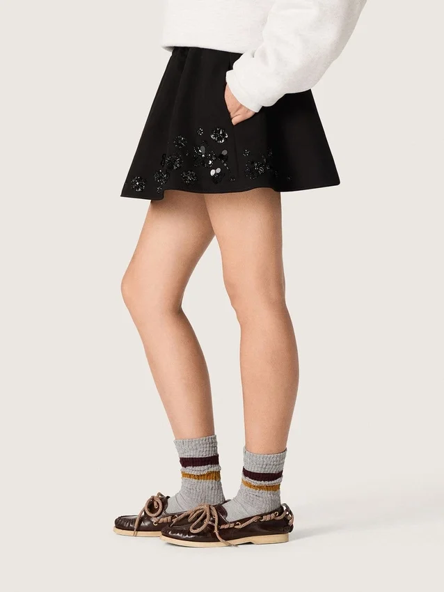 Women’s miniskirt in black cotton twill with floral sequin embroidery