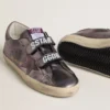 Women’s Old School in purple laminated leather with lilac nubuck star and heel tab