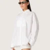 Women's oversized shirt in white cotton with pleated detail and jewel buttons
