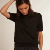 Women’s polo shirt in black merino wool