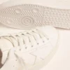 Women’s Purestar sneakers with gold-coloured heel tab