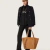 Women's shirt in black wool twill with floral embroidery in glass beads