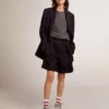 Women's shorts in black wool gabardine with waist belt