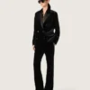 Women's slim-fit flared pants in black cotton velvet