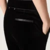 Women's slim-fit flared pants in black cotton velvet