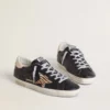 Women’s Super-Star in black nappa leather with zebra-print pony skin star and beige leather heel tab