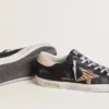 Women’s Super-Star in black nappa leather with zebra-print pony skin star and beige leather heel tab