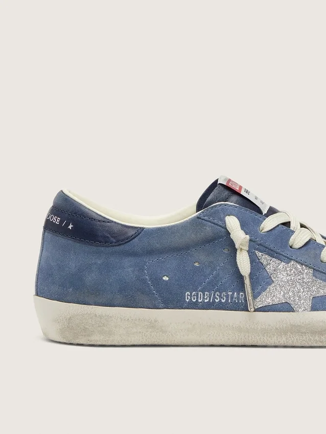Women’s Super-Star in denim-blue suede with silver glitter star