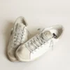 Women's Super-Star in white leather with perforated star and beige nubuck heel tab