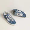 Women's Super-Star LTD in light blue denim with a white leather star and embroidered flowers